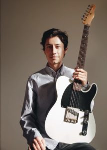 photo of Emmanuel Ramirez with guitar