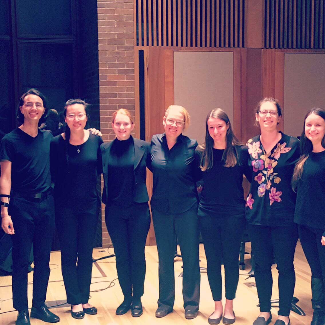 Divergent Studio performers pose on stage together